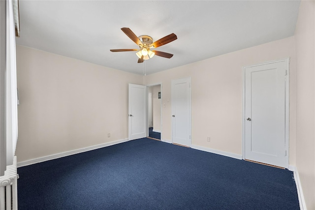 247-78 77th Cres Unit B, Bellerose, NY 11426 - unfurnished bedroom with dark carpet, baseboards, and a ceiling fan