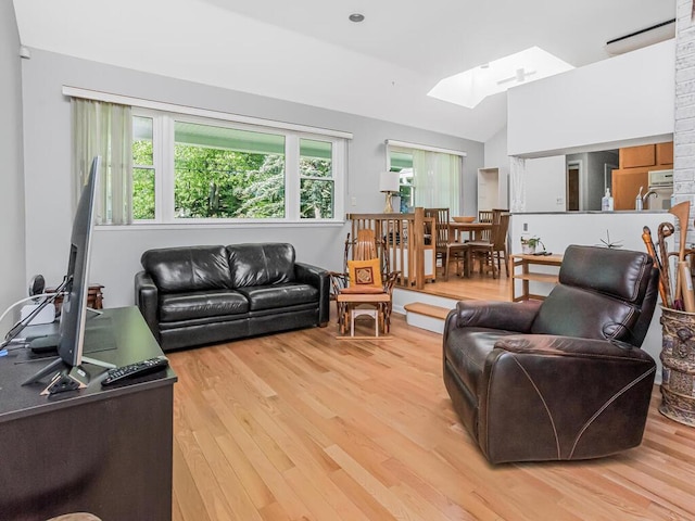 81 Winding Brook Rd, New Rochelle, NY 10804 - living room with a skylight, lofted ceiling, and wood finished floors