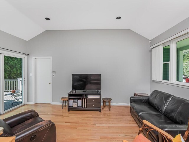 81 Winding Brook Rd, New Rochelle, NY 10804 - living room featuring lofted ceiling, plenty of natural light, light wood-style floors, and baseboards