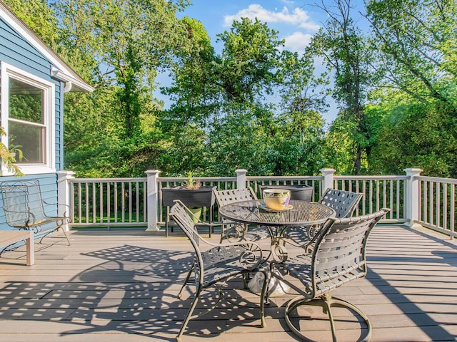 81 Winding Brook Rd, New Rochelle, NY 10804 - wooden deck with outdoor dining area and view of wooded area