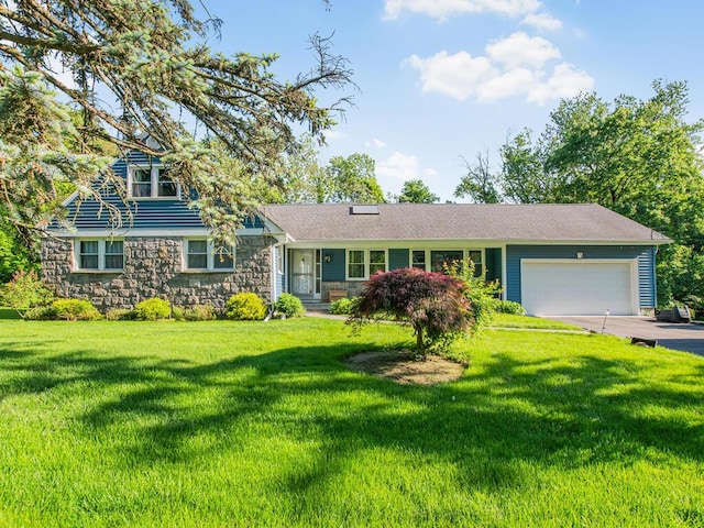 81 Winding Brook Rd, New Rochelle, NY 10804 - view of front of home featuring stone siding, an attached garage, asphalt driveway, and a front yard
