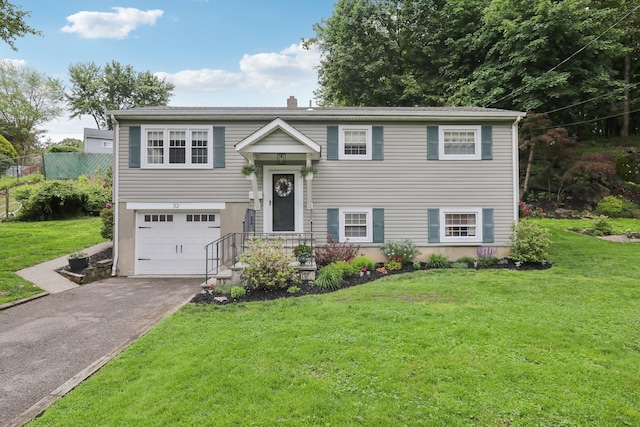 32 Meadow Rd, Montrose, NY 10567 - raised ranch with asphalt driveway, a garage, and a chimney