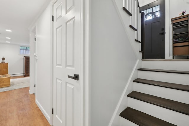 32 Meadow Rd, Montrose, NY 10567 - stairway with a baseboard heating unit, wood finished floors, recessed lighting, plenty of natural light, and baseboards