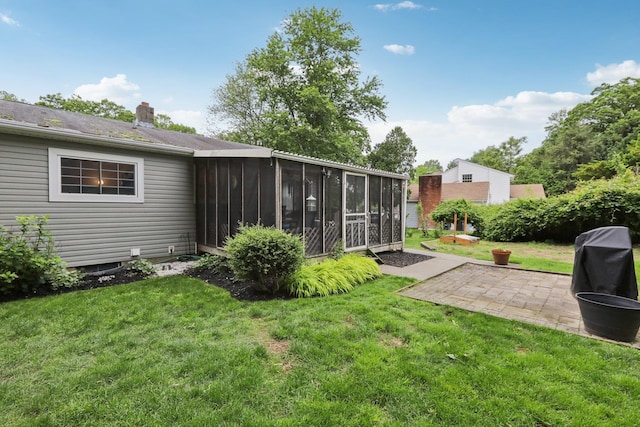 32 Meadow Rd, Montrose, NY 10567 - view of green lawn featuring a sunroom and a patio