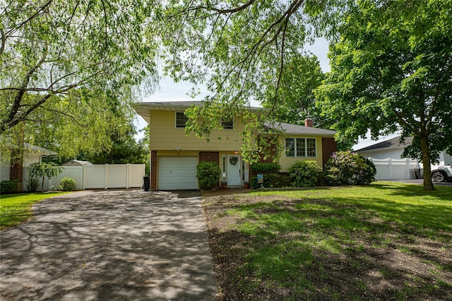 8 Baylor Dr, Smithtown, NY 11787 - tri-level home featuring driveway, brick siding, a garage, and a chimney