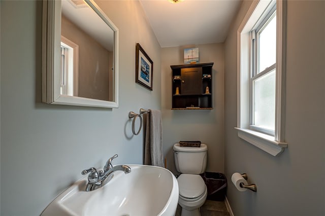 8 Baylor Dr, Smithtown, NY 11787 - half bathroom featuring toilet, a sink, and baseboards