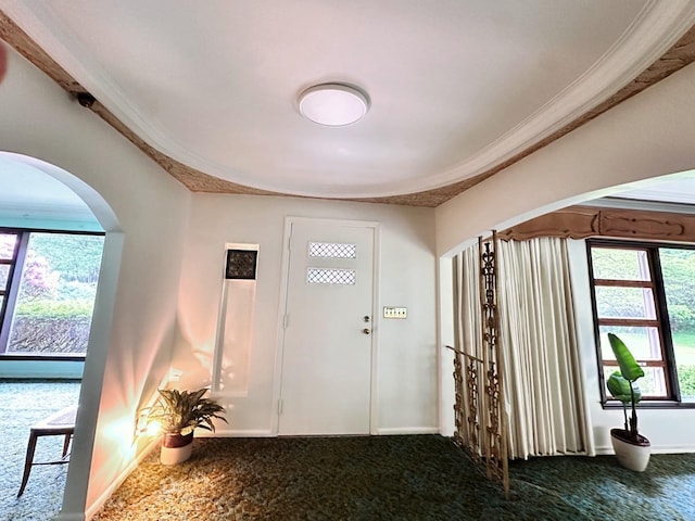 29 Maiden Ln, Port Jervis, NY 12771 - entryway featuring arched walkways, ornamental molding, carpet, plenty of natural light, and baseboards