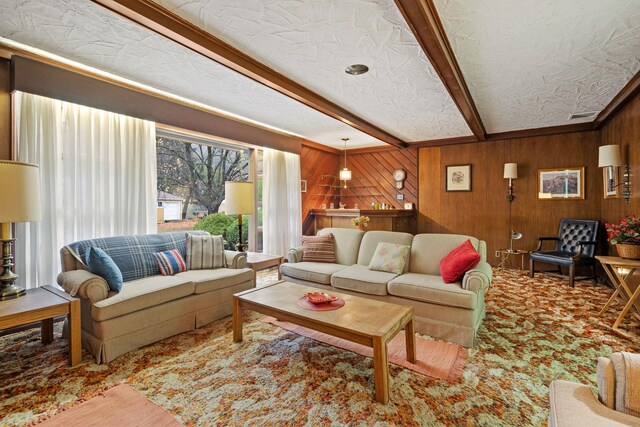 29 Maiden Ln, Port Jervis, NY 12771 - living area with beamed ceiling, wood walls, and a textured ceiling