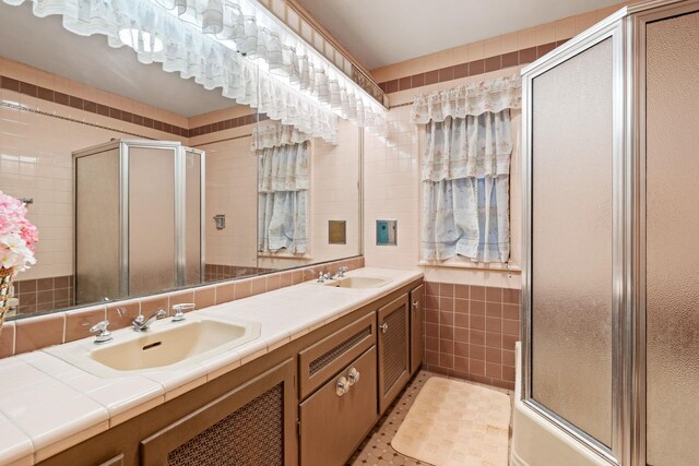 29 Maiden Ln, Port Jervis, NY 12771 - bathroom featuring tile walls, a shower with shower door, and double vanity