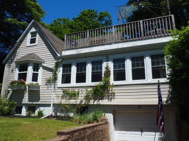 20 Locust Rd, Wading River, NY 11792 - view of home's exterior with a balcony, a garage, and a lawn