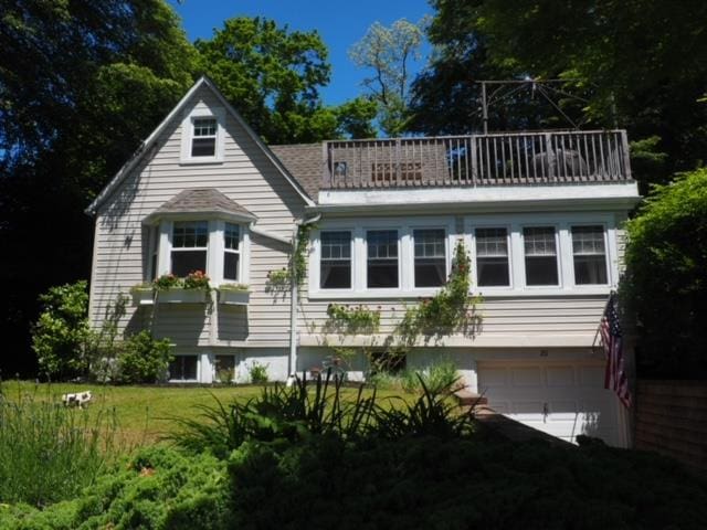 20 Locust Rd, Wading River, NY 11792 - view of front facade with an attached garage and a balcony