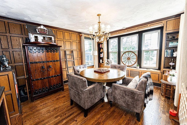 31 Heminway Ave, New Rochelle, NY 10801 - dining room with a chandelier, dark wood finished floors, crown molding, and wooden walls