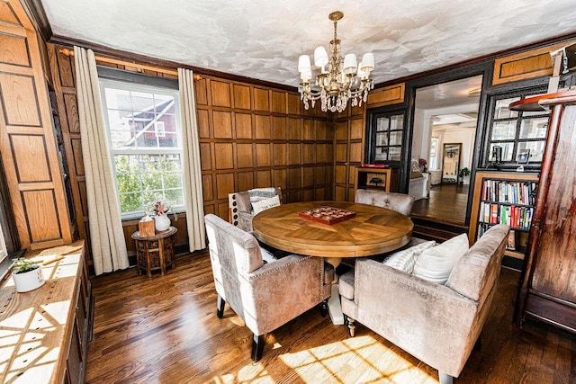 31 Heminway Ave, New Rochelle, NY 10801 - dining room with crown molding, a chandelier, and wood finished floors
