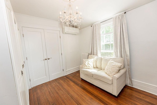 31 Heminway Ave, New Rochelle, NY 10801 - living area with an AC wall unit, baseboards, wood finished floors, and a chandelier