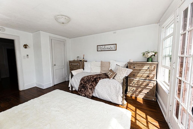 31 Heminway Ave, New Rochelle, NY 10801 - bedroom with dark wood-style flooring and baseboards