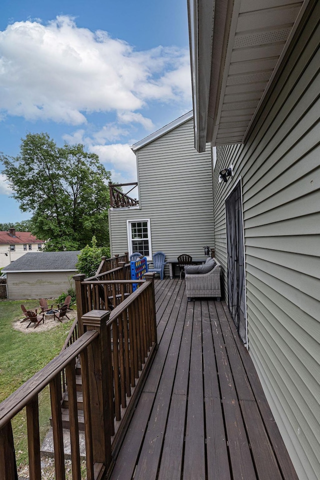 31 Heminway Ave, New Rochelle, NY 10801 - wooden deck with an outdoor fire pit and a yard