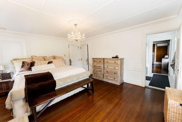 31 Heminway Ave, New Rochelle, NY 10801 - bedroom with a decorative wall, dark wood-style floors, and a chandelier