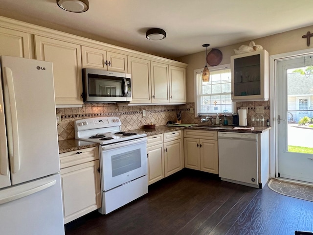 75A Enfield Ct Unit 75A, Ridge, NY 11961 - kitchen featuring white appliances, healthy amount of natural light, tasteful backsplash, and a sink