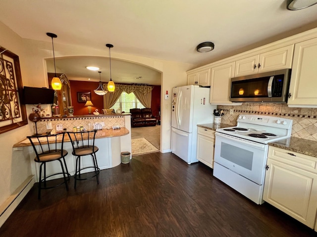 75A Enfield Ct Unit 75A, Ridge, NY 11961 - kitchen with white appliances, a baseboard heating unit, dark wood-style flooring, and white cabinets