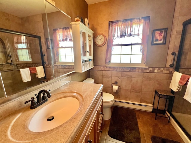 75A Enfield Ct Unit 75A, Ridge, NY 11961 - full bath with baseboard heating, a shower stall, healthy amount of natural light, toilet, and tile walls
