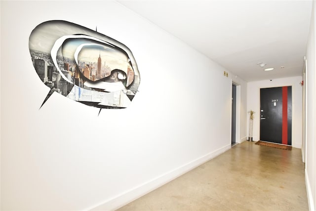 70 S Main St Unit 307-Ph, Freeport, NY 11520 - hall with concrete flooring and baseboards