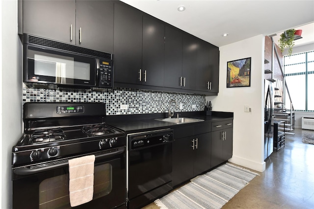70 S Main St Unit 307-Ph, Freeport, NY 11520 - kitchen with black appliances, dark cabinetry, a sink, dark countertops, and tasteful backsplash