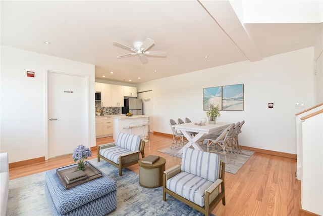 70 S Main St Unit 307-Ph, Freeport, NY 11520 - living area featuring light wood finished floors, a ceiling fan, baseboards, and recessed lighting