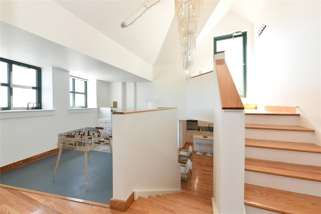 70 S Main St Unit 307-Ph, Freeport, NY 11520 - stairway with baseboards, wood finished floors, and high vaulted ceiling