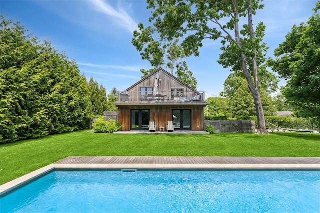 3 Pheasant Ln, Remsenburg, NY 11960 - back of property featuring french doors, an outdoor pool, and a deck