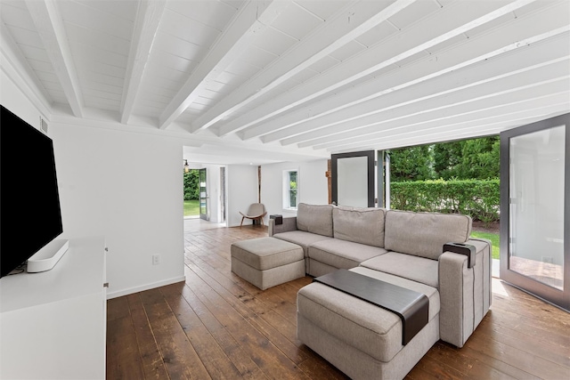3 Pheasant Ln, Remsenburg, NY 11960 - living area with dark wood finished floors, beamed ceiling, and baseboards