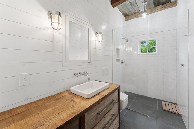 3 Pheasant Ln, Remsenburg, NY 11960 - bathroom with a walk in shower, toilet, vanity, tile patterned flooring, and beam ceiling
