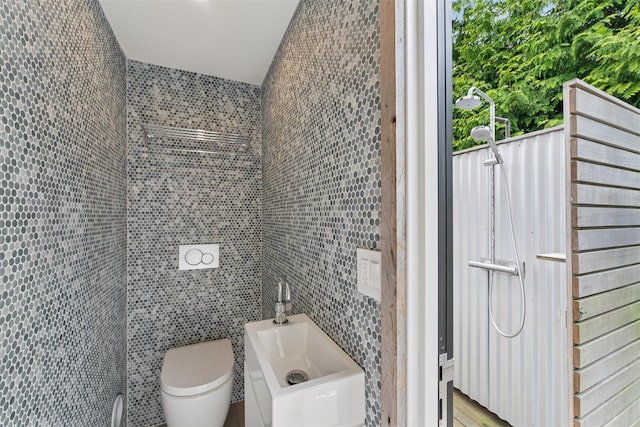 3 Pheasant Ln, Remsenburg, NY 11960 - bathroom featuring tile walls, toilet, wood finished floors, and a sink