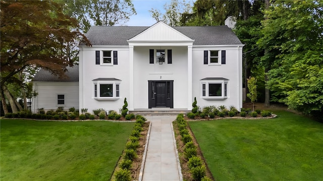 2 Crawford Rd, Harrison, NY 10528 - neoclassical home with a shingled roof and a front lawn