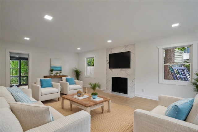 2 Crawford Rd, Harrison, NY 10528 - living area featuring light wood finished floors, a fireplace, recessed lighting, and baseboards