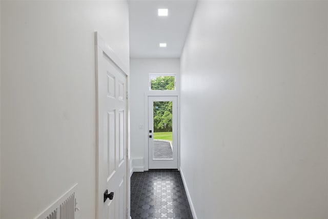 2 Crawford Rd, Harrison, NY 10528 - corridor with dark tile patterned floors and baseboards