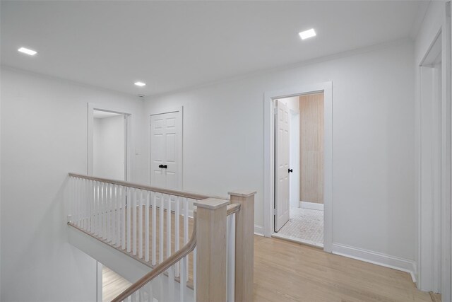 2 Crawford Rd, Harrison, NY 10528 - corridor with an upstairs landing, light wood-type flooring, recessed lighting, and baseboards