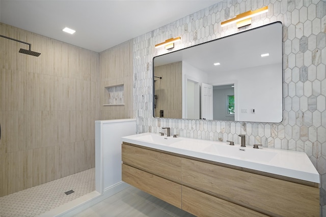 2 Crawford Rd, Harrison, NY 10528 - bathroom with a walk in shower, double vanity, tile patterned flooring, and tile walls