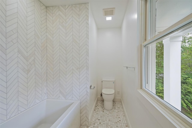 2 Crawford Rd, Harrison, NY 10528 - bathroom featuring toilet, tile patterned floors, baseboards, and shower / tub combination
