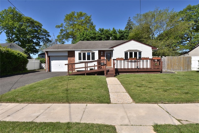 324 W 16th St, Deer Park, NY 11729 - ranch-style home featuring a garage, driveway, a deck, and brick siding