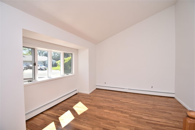 324 W 16th St, Deer Park, NY 11729 - unfurnished room with a baseboard radiator, baseboard heating, vaulted ceiling, wood finished floors, and baseboards