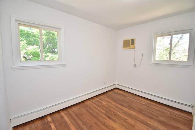 324 W 16th St, Deer Park, NY 11729 - unfurnished room featuring a wall unit AC, plenty of natural light, wood finished floors, and a baseboard heating unit