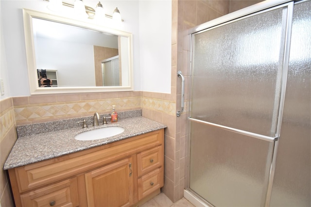 324 W 16th St, Deer Park, NY 11729 - full bathroom featuring tile walls, vanity, a stall shower, and a wainscoted wall