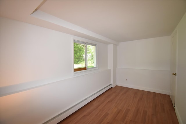 324 W 16th St, Deer Park, NY 11729 - empty room with wood finished floors, baseboards, and a baseboard radiator