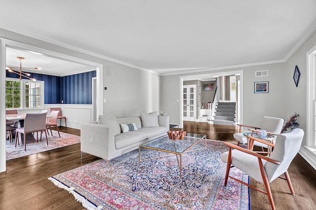 9 Springdale Rd, Scarsdale, NY 10583 - living area with a chandelier, dark wood finished floors, crown molding, stairway, and french doors