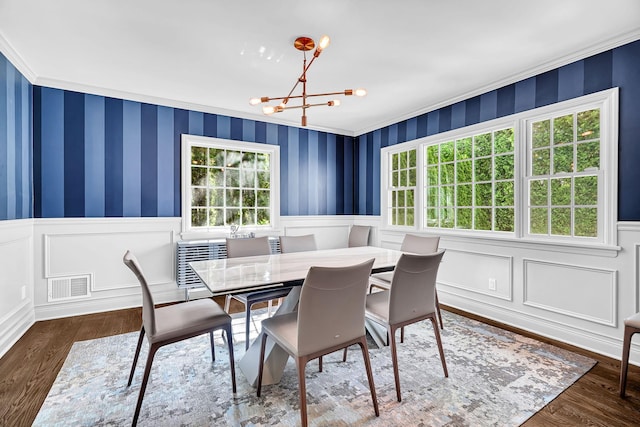 9 Springdale Rd, Scarsdale, NY 10583 - dining area with plenty of natural light, a chandelier, wainscoting, crown molding, and wood finished floors