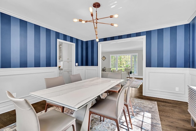 9 Springdale Rd, Scarsdale, NY 10583 - dining space with a chandelier, crown molding, a wainscoted wall, dark wood-type flooring, and a decorative wall