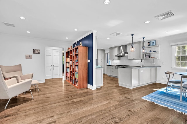 9 Springdale Rd, Scarsdale, NY 10583 - kitchen featuring wall chimney exhaust hood, ornamental molding, a sink, open shelves, and backsplash