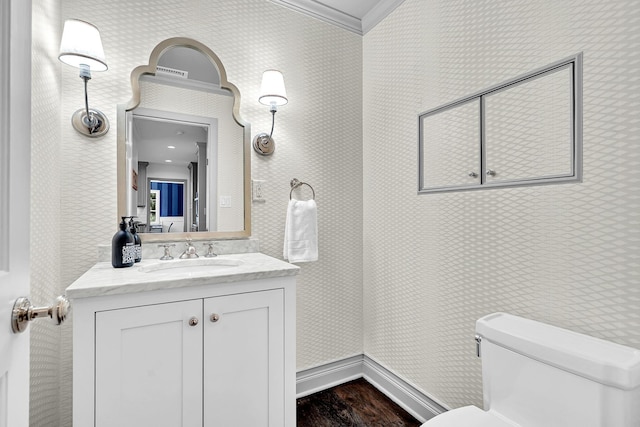 9 Springdale Rd, Scarsdale, NY 10583 - bathroom featuring ornamental molding, toilet, wood finished floors, vanity, and wallpapered walls
