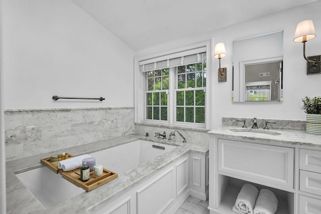 9 Springdale Rd, Scarsdale, NY 10583 - bathroom with vanity, a bath, lofted ceiling, and marble finish floors