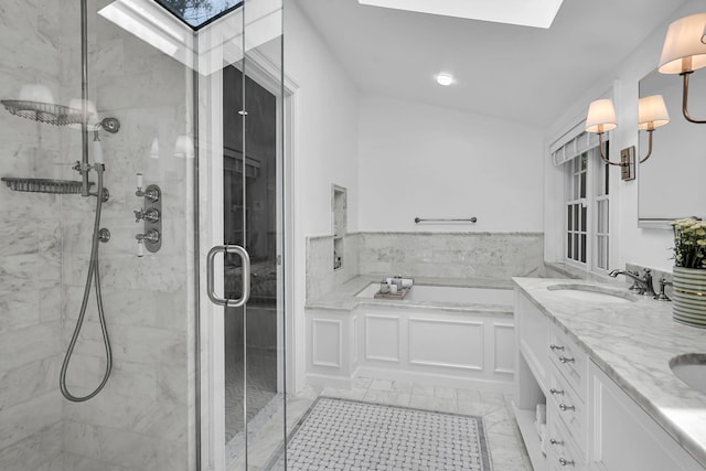 9 Springdale Rd, Scarsdale, NY 10583 - full bathroom with a skylight, a stall shower, a bath, and double vanity